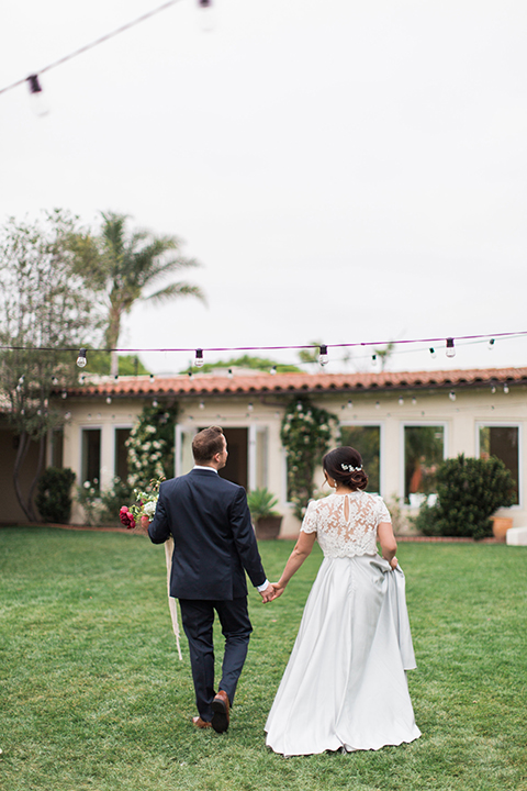 San-diego-outdoor-wedding-at-the-inn-at-rancho-santa-fe-bride-and-groom-walking-holding-hands