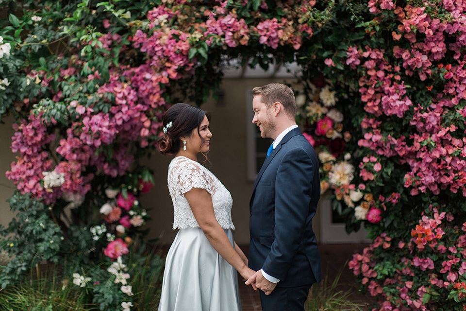 San-diego-outdoor-wedding-at-the-inn-at-rancho-santa-fe-ceremony-bride-and-groom-holding-hands