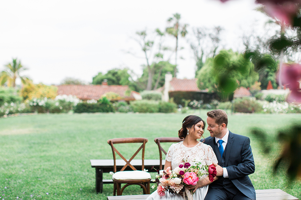 San-diego-outdoor-wedding-at-the-inn-at-rancho-santa-fe-ceremony-bride-and-groom-sitting