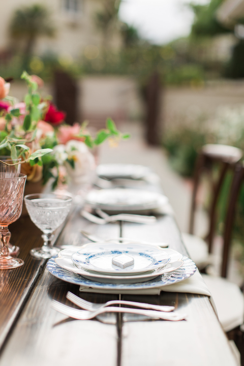 San-diego-outdoor-wedding-at-the-inn-at-rancho-santa-fe-table-set-up-with-flowers-and-place-settings