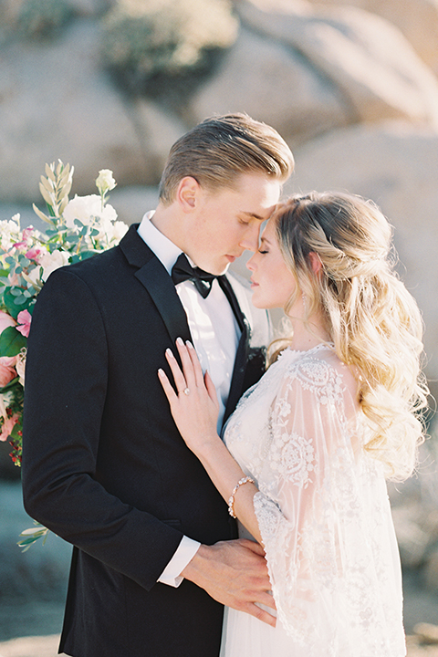 Joshua-tree-wedding-shoot-at-the-ruin-venue-bride-and-groom-hugging-close-up