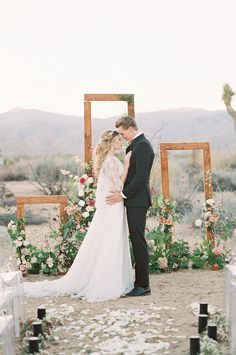 Joshua-tree-wedding-shoot-at-the-ruin-venue-ceremony-bride-and-groom-hugging