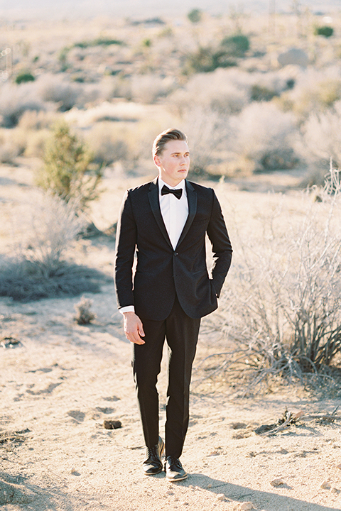 Joshua-tree-wedding-shoot-at-the-ruin-venue-groom-black-tuxedo-with-black-bow-tie