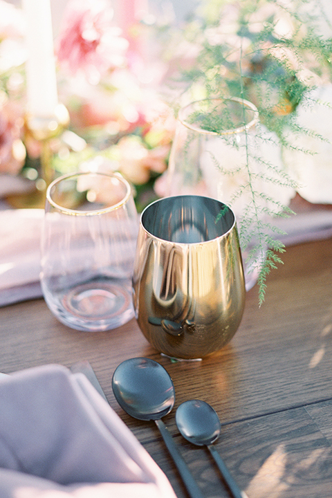 Joshua-tree-wedding-shoot-at-the-ruin-venue-table-set-up-with-glasses-and-flowers