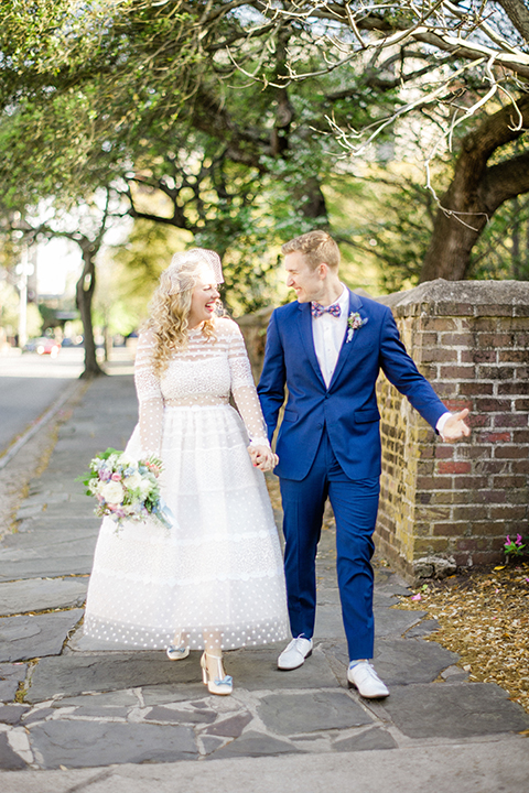 South-carolina-summer-outdoor-wedding-at-the-wickliffe-house-bride-and-groom-holding-hands-and-walking