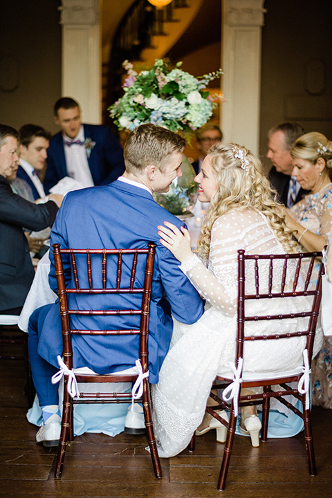 South-carolina-summer-outdoor-wedding-at-the-wickliffe-house-reception-bride-and-groom-sitting-smiling