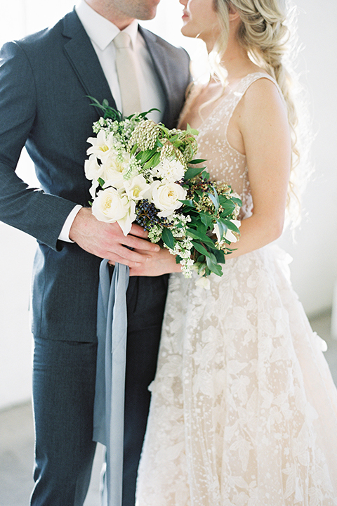 Los-angeles-modern-wedding-at-fd-photo-studio-bride-and-groom-hugging-with-bouquet