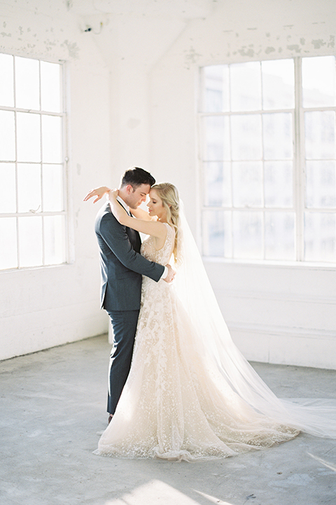 Los-angeles-modern-wedding-at-fd-photo-studio-bride-and-groom-standing-hugging