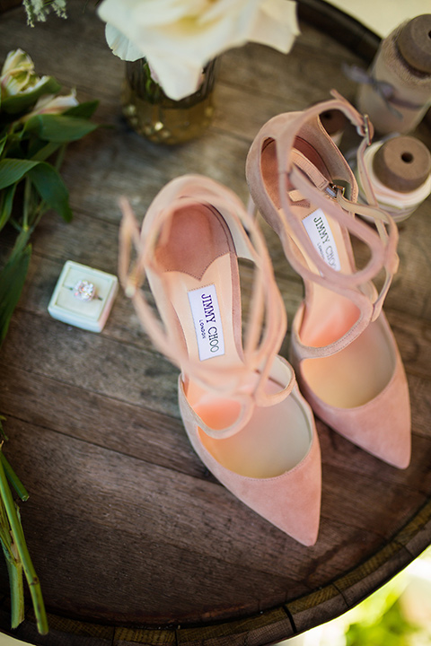 lot-8-bridal-shoes-blush-color-pointed-toe-heels-with-ring-next-to-it-on-wooden-table