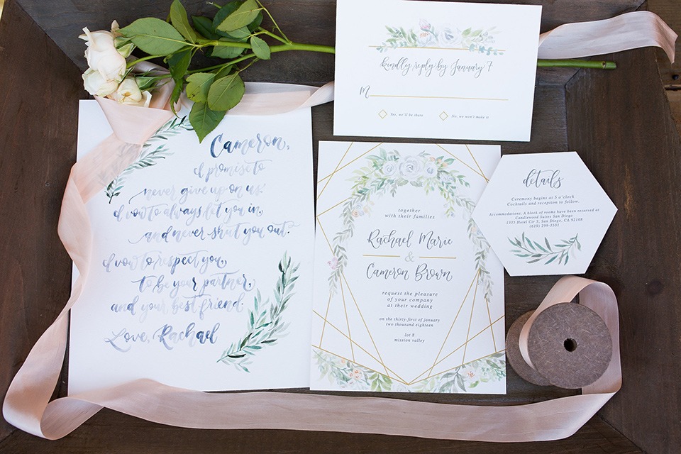 lot-8-invitations-with-rose-colored-ribbon-and-white-invitations-that-have-floral-embellishments-andcalligraphy