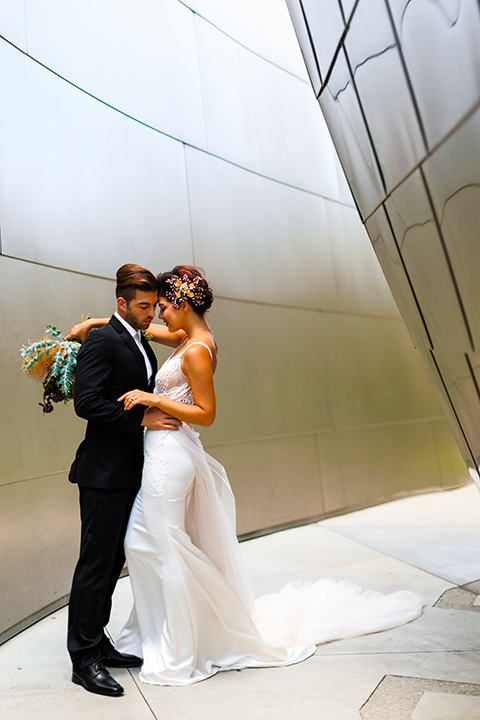 Downtown-los-angeles-wedding-shoot-at-oue-skyspace-bride-and-groom-hugging-front-view-smiling