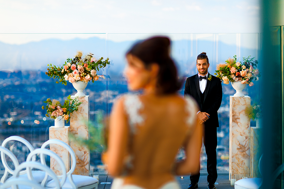 Downtown-los-angeles-wedding-shoot-at-oue-skyspace-ceremony-bride-and-groom-walking-down-the-aisle