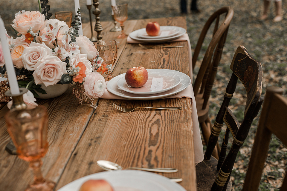 Texas-peaches-and-cream-wedding-shoot-at-carola-horse-ranch-table-set-up-with-place-setting-and-flowers