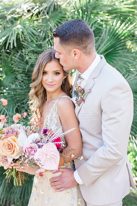 Los-angeles-garden-wedding-at-retreat-malibu-bride-and-groom-hugging-and-kissing