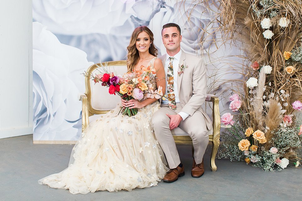 Los-angeles-garden-wedding-at-retreat-malibu-bride-and-groom-lounge-sitting