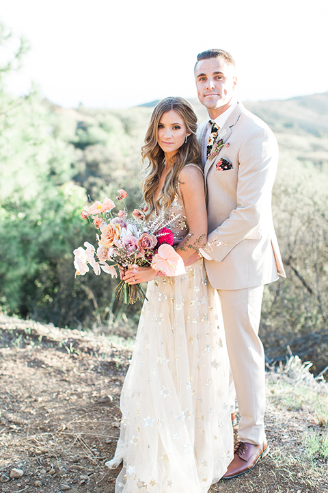 Los-angeles-garden-wedding-at-retreat-malibu-bride-and-groom-standing-hugging