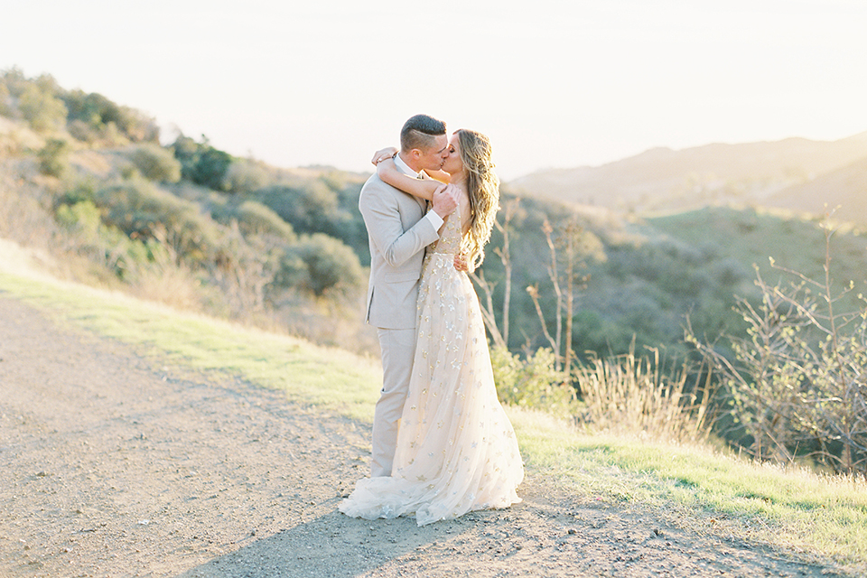 Los-angeles-garden-wedding-at-retreat-malibu-bride-and-groom-standing-kissing