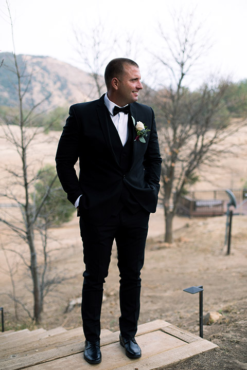 sacred-mountain-shoot-groom-standing-with-hands-in-pockets