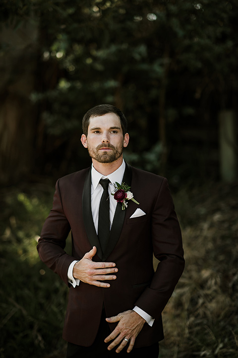 saddle-peak-groom-groom-in-a-burgundy-tuxedo-with-a-long-tie