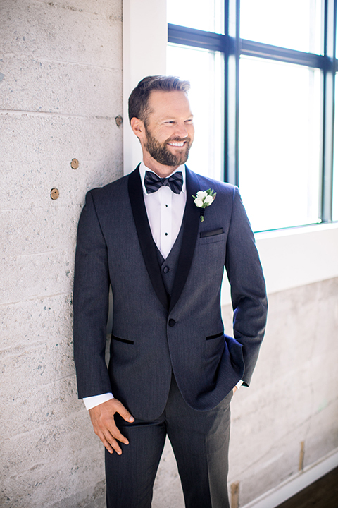 Same-sex-industrial-wedding-at-the-1912-groom-charcoal-tuxedo