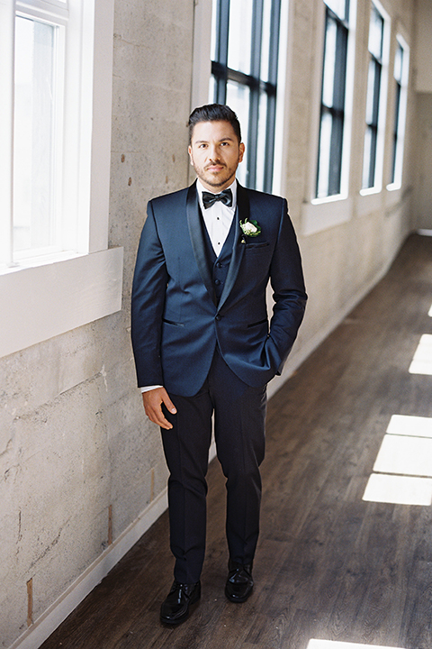 Same-sex-industrial-wedding-at-the-1912-groom-navy-tuxedo-standing