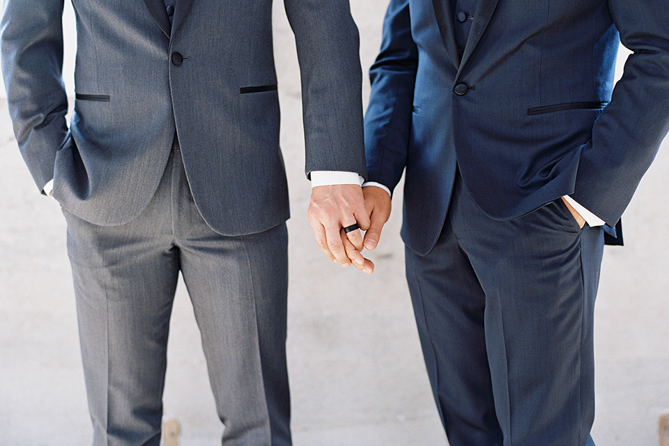 Same-sex-industrial-wedding-at-the-1912-grooms-holding-hands-outside-close-up