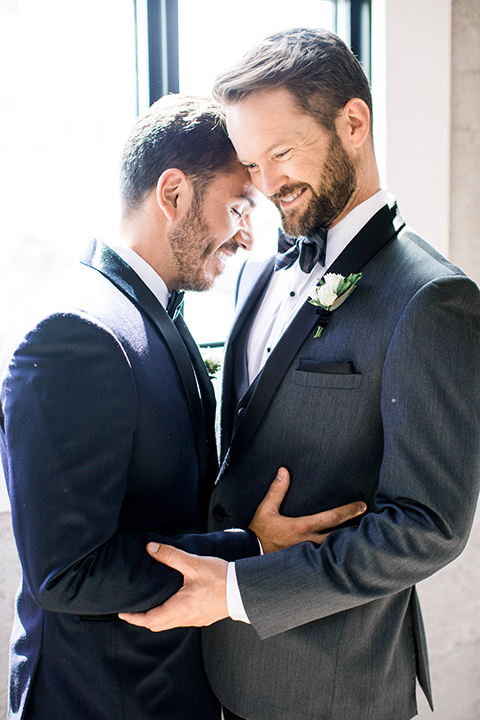 Same-sex-industrial-wedding-at-the-1912-grooms-hugging