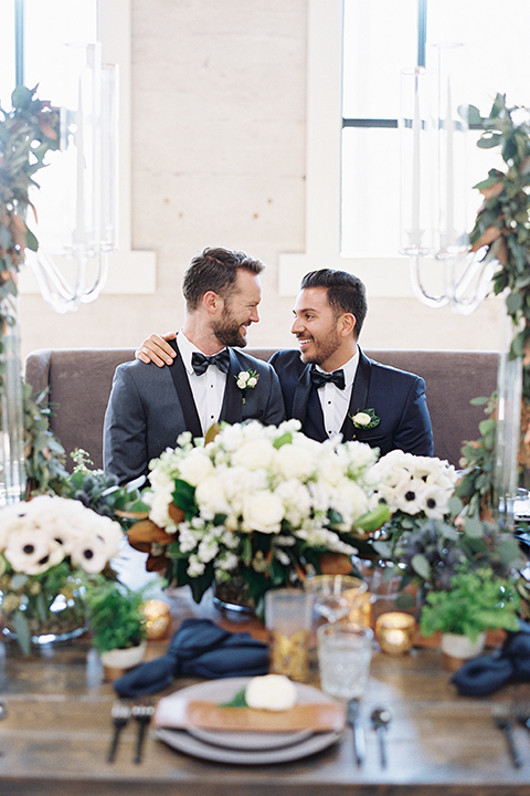 Same-sex-industrial-wedding-at-the-1912-grooms-sitting-at-table