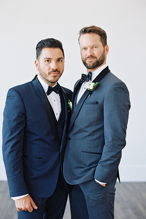 Same-sex-industrial-wedding-at-the-1912-grooms-standing-and-hugging