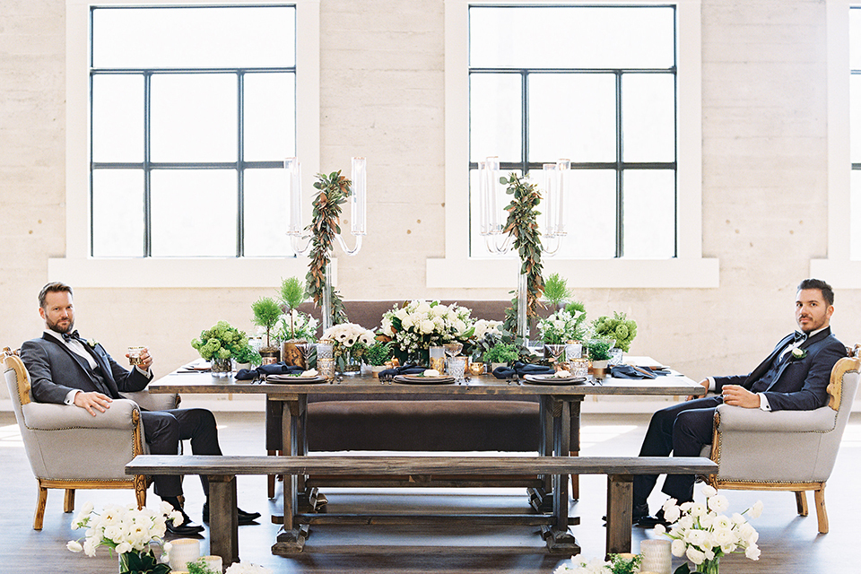 Same-sex-industrial-wedding-at-the-1912-table-set-up-grooms-sitting-across-table