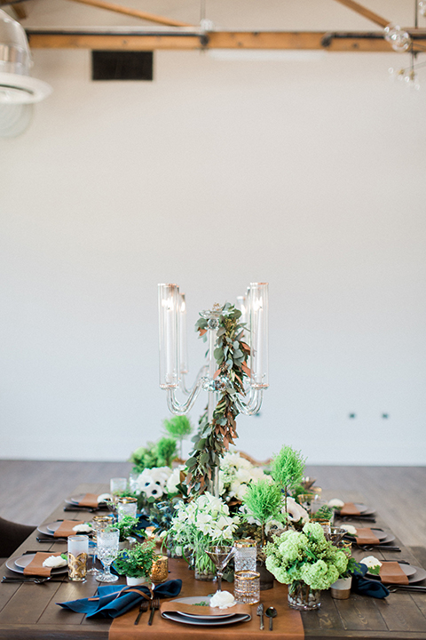 Same-sex-industrial-wedding-at-the-1912-table-set-up-with-flowers