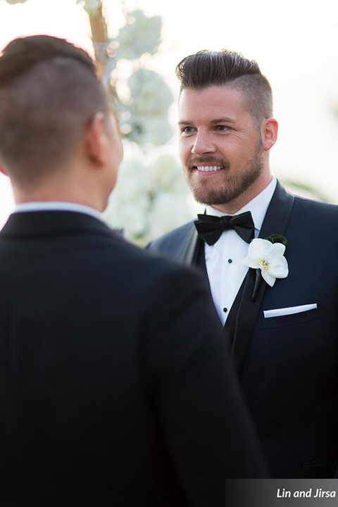 Laguna-beach-outdoor-wedding-same-sex-ceremony-grooms-holding-hands-smiling