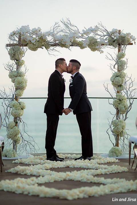 Laguna-beach-outdoor-wedding-same-sex-ceremony-grooms-kissing