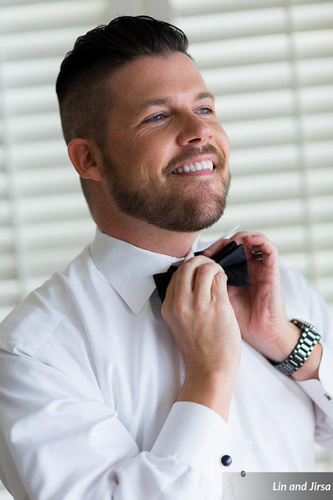 Laguna-beach-outdoor-wedding-same-sex-groom-getting-ready-bow-tie