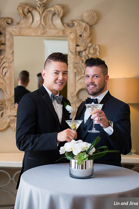 Laguna-beach-outdoor-wedding-same-sex-grooms-holding-drinks