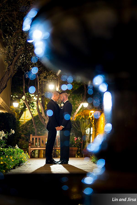 Laguna-beach-outdoor-wedding-same-sex-grooms-standing-holding-hands