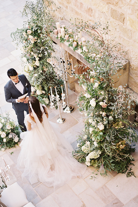 Santa-barbara-outdoor-wedding-at-sunstone-winery-ceremony-bride-and-groom-exchanging-vows