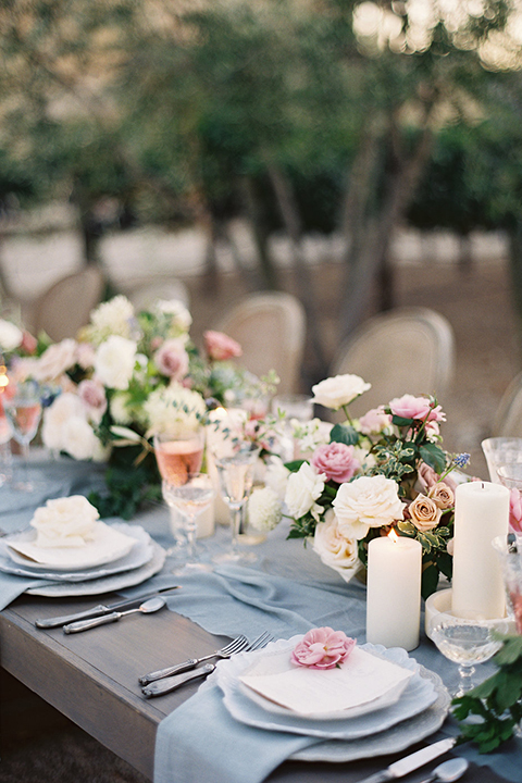 Santa-barbara-outdoor-wedding-at-sunstone-winery-table-set-up-with-place-settings-and-flowers