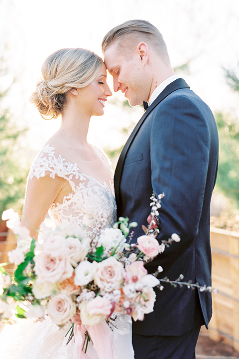 Southern-california-outdoor-wedding-at-the-orange-grove-bride-and-groom-hugging-smiling