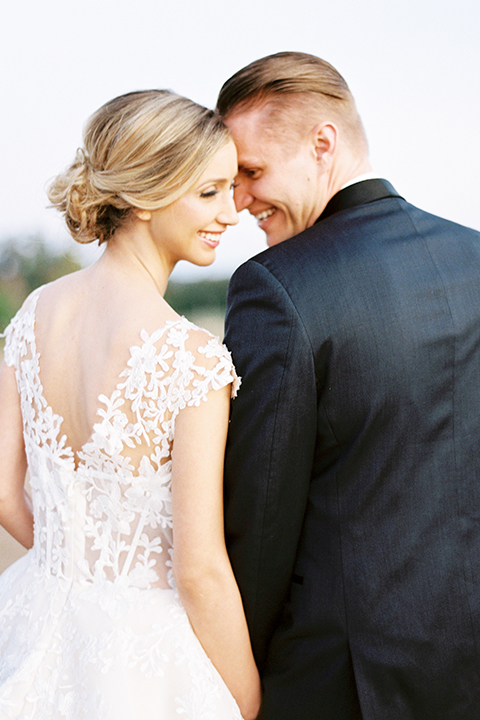 Southern-california-outdoor-wedding-at-the-orange-grove-bride-and-groom-standing-holding-hands-close-up