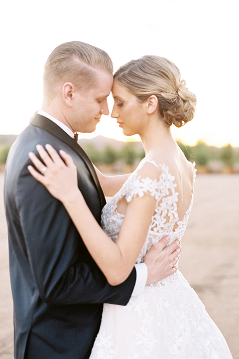 Southern-california-outdoor-wedding-at-the-orange-grove-bride-and-groom-standing-hugging-close-up