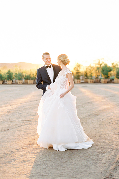 Southern-california-outdoor-wedding-at-the-orange-grove-bride-and-groom-standing-walking-smiling