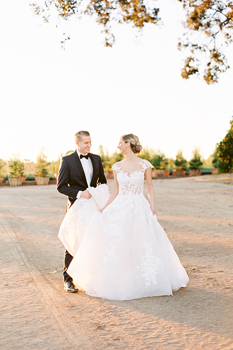 Southern-california-outdoor-wedding-at-the-orange-grove-bride-and-groom-standing-walking