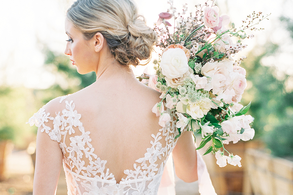 Southern-california-outdoor-wedding-at-the-orange-grove-bride-holding-bouquet-back-close-up