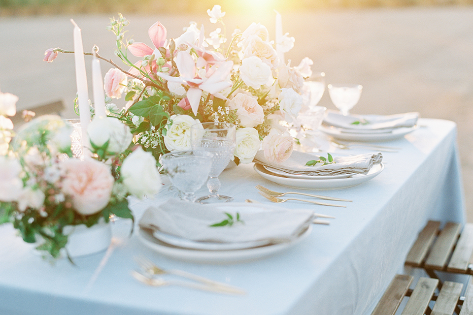 Southern-california-outdoor-wedding-at-the-orange-grove-table-set-up-with-flowers-and-place-settings