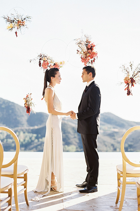 Malibu-rocky-oaks-valentines-day-wedding-shoot-ceremony-bride-and-groom-holding-hands