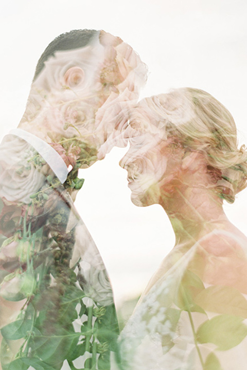 mountain-elopement-shoot-floral-imposed-couple-photo-Bride-in-a-tulle-ball-gown-with-an-illusion-bodice-and-lace-detailing-groom-at-sweetheart-table-groom-in-a-grey-tuxedo-with-a-black-bowtie