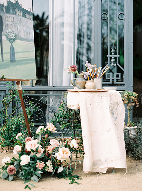 Artist-and-his-muse-shoot-cake-on-the-table