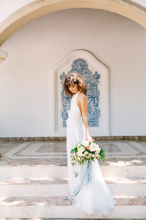 Rancho-las-lomas-blue-shoot-bride-in-gown-in-a-flowing-white-gown-and-a-halter-neckline