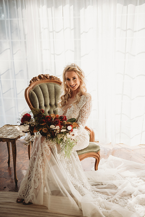 owl-creek-farms-bride-sitting-down-bride-wearing-a-boho-style-dress-with-long-sleeves-and-a-high-neckline